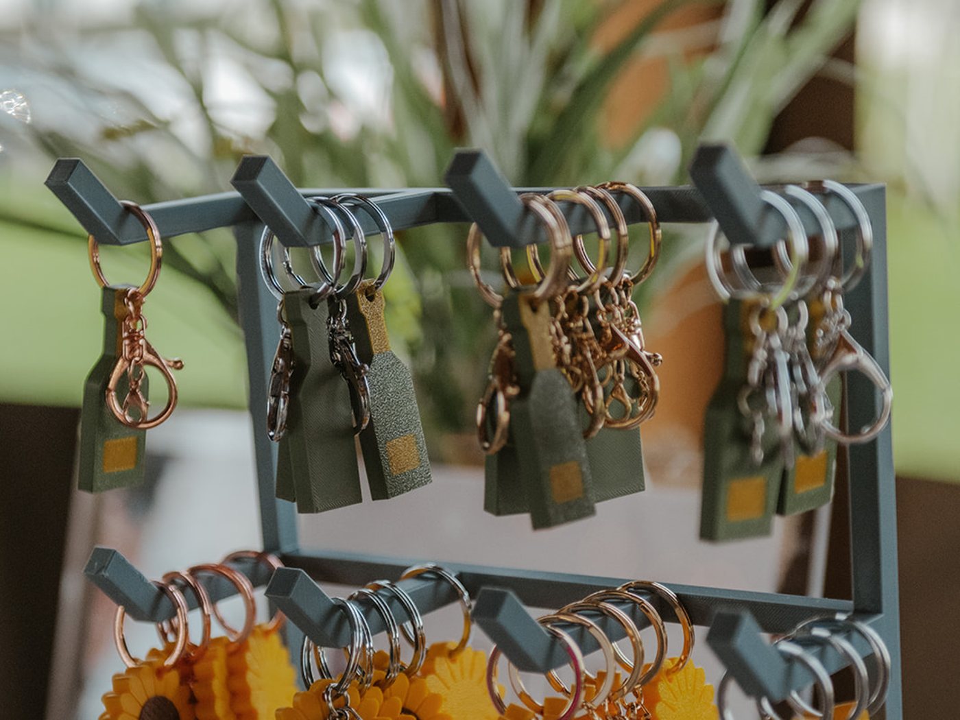 Keyrings in rose gold, silver, gold and gunmetal hanging on the TapLoop display rack